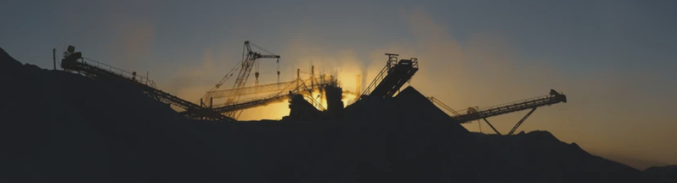 Crushing plant silhouetted against an Arizona sunset