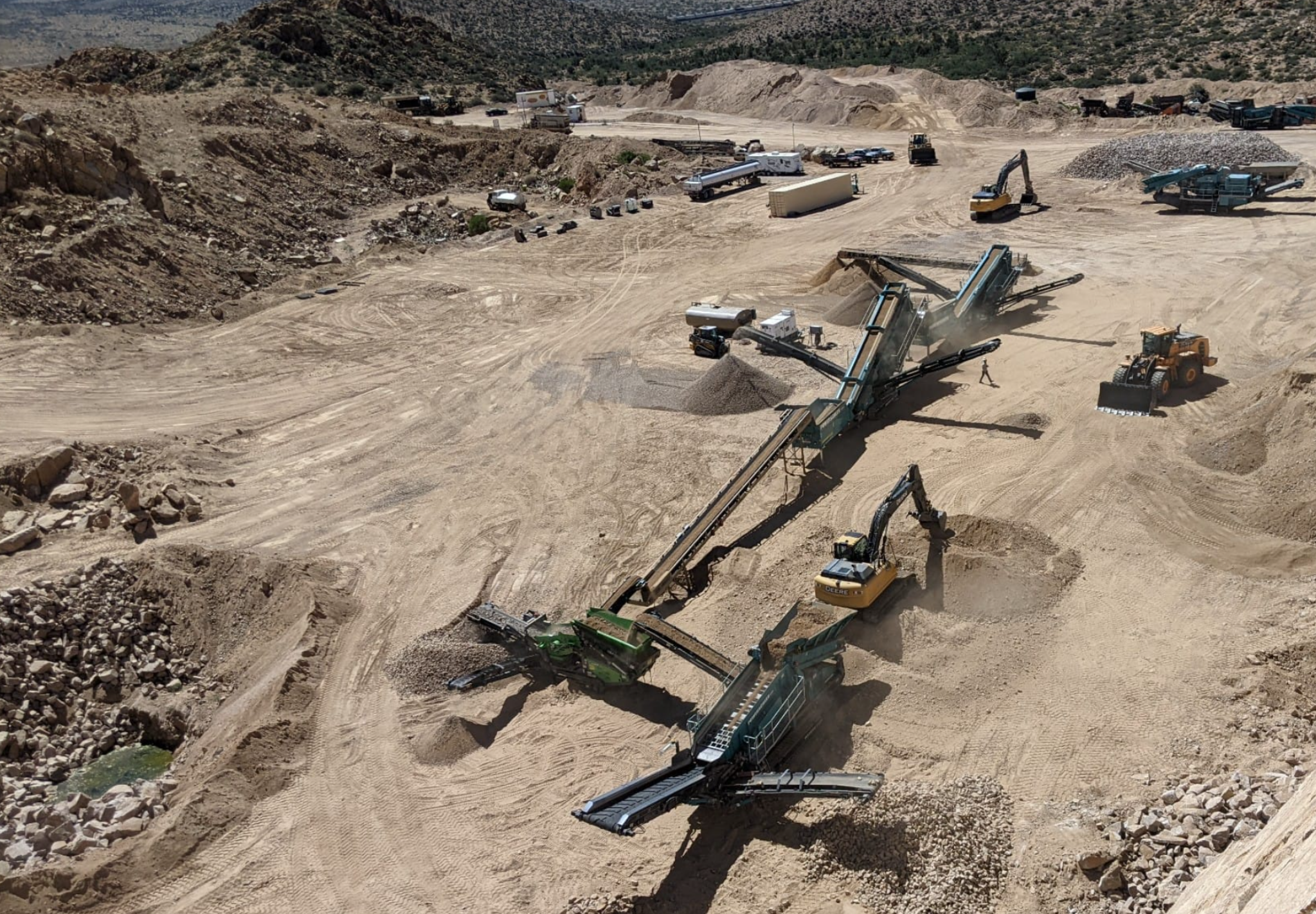 Onyx mobile crushing plant set up at a remote Arizona quarry — aerial view of full operation