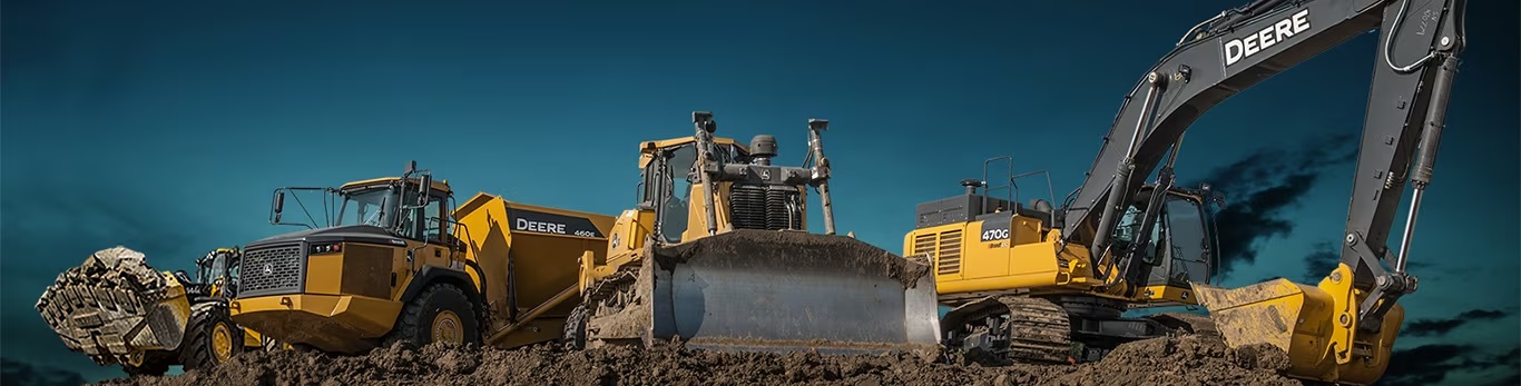 Heavy construction equipment fleet — articulated truck, wheel loader, dozer, and excavator on a jobsite